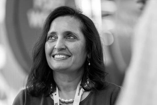 Texas Tribune CEO Sonal Shah speaks with members and festival attendees during a happy hour at The Texas Tribune Festival 2024, in downtown Austin, Texas, on Thursday, Sept. 7, 2024.
