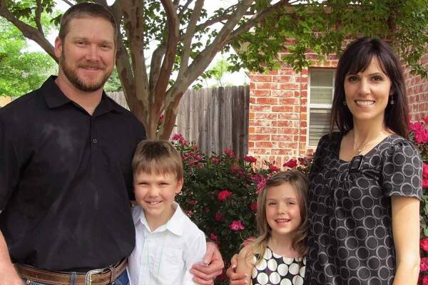 Chris Kyle and wife Taya pose for a photo together with their two kids Colton and McKenna.