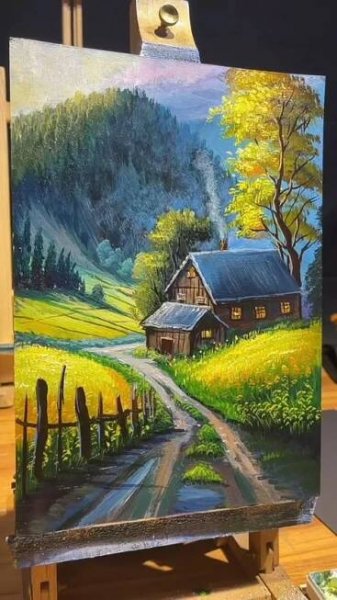 an easel with a painting on it that has a farm scene painted on it