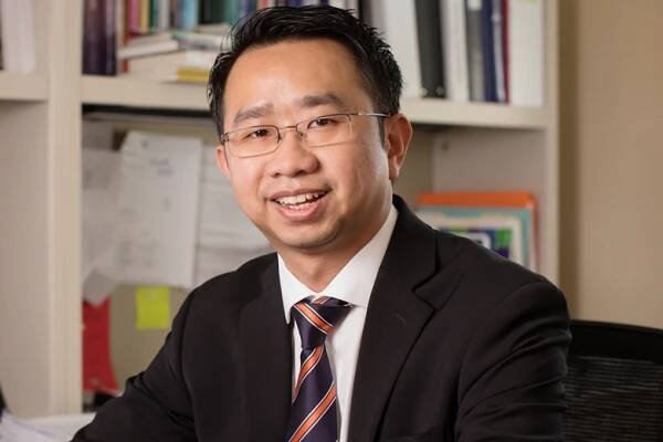 headshot image of Kevin Tan