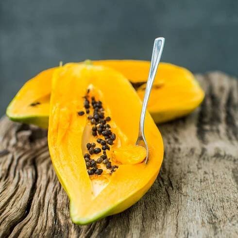 Papaya on wooden board
