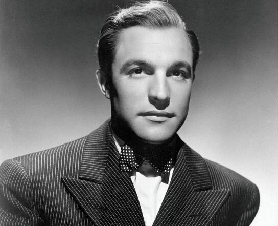 Gene Kelly in black suit and bow tie