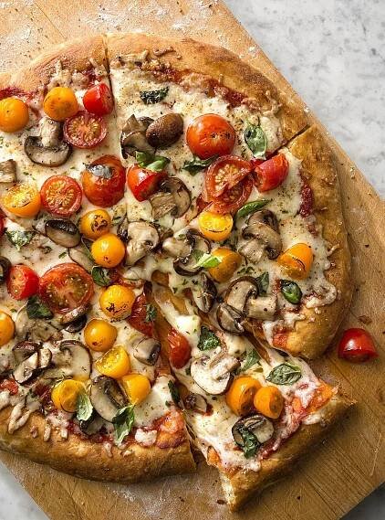 Artisan style pizza with grape tomatoes, mushrooms and basil for Ross stores