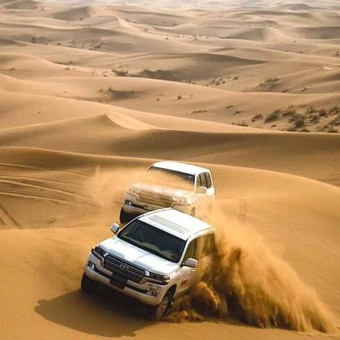 Dubaj: Pouštní safari, jízda na velbloudech, sandboarding, čtyřkolky | GetYourGuide