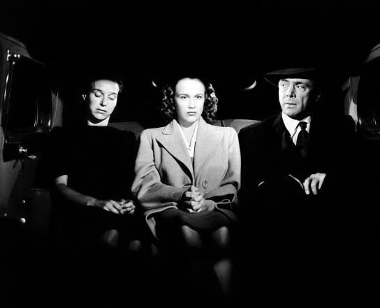 WHEN STRANGERS MARRY, (aka BETRAYED), Kim Hunter (center), Dean Jagger (right), 1944