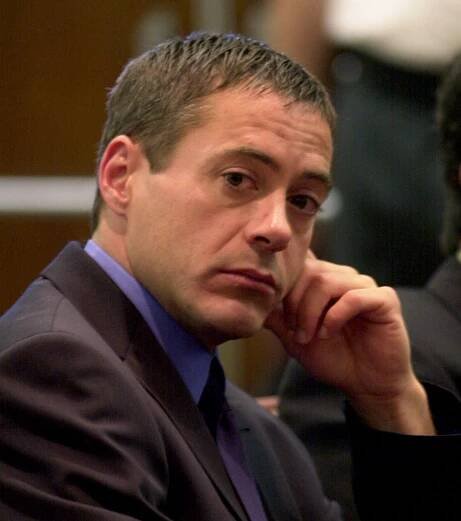 Robert Downey Jr. sits in a courtroom.