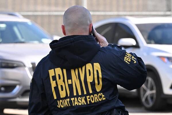 FBI-NYPD Joint Task Force agent on a phone call.