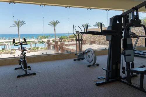 a gym with a view of a resort at Caesar Bay Resort in Marsa Matruh