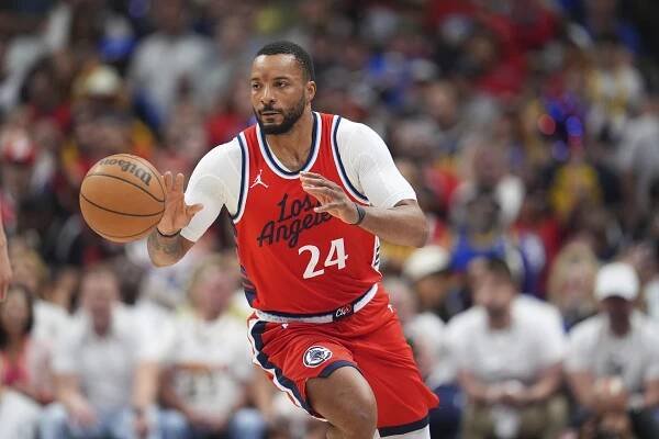 Los Angeles Clippers player dribbling a basketball.