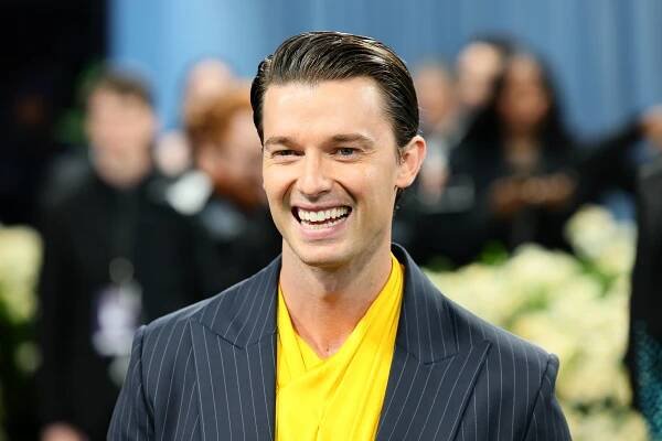 Patrick Schwarzenegger smiles at the Met Gala 2025