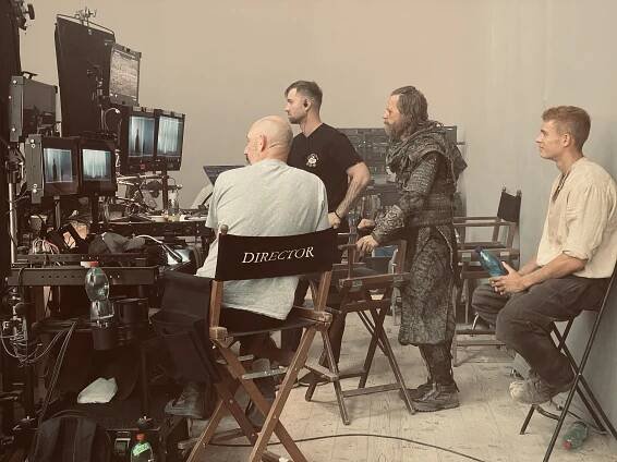 Fredrik Wagner, Josh Stradowski, and director Thomas Napper watching playback during the Rhuidean scene on the set of The Wheel of Time