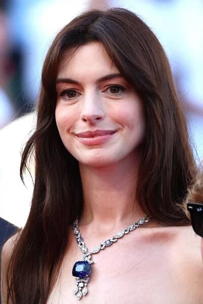 Anne Hathaway attends the screening of "Armageddon Time" in stunning white dress