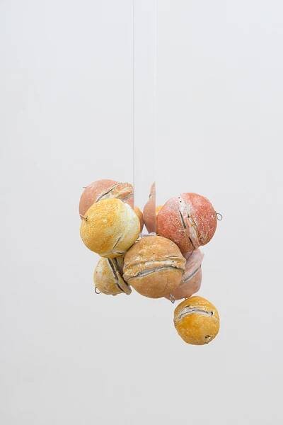 Untitled (Citrus Balls 5) Solid cast acrylic rod, various citrus fruit rinds, epoxy putty, oil pastel, stainless steel wire, and enamel; dimensions variable; 2018