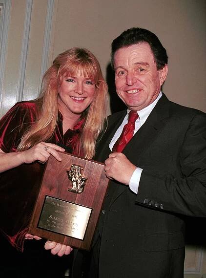 Actress Susan Olsen, who starred as Cindy from "The Brady Bunch," poses with actor Jerry Mathers, who starred in "Leave It To Beaver," at the Holly Jolly Jubilee TV and Motion Picture Mothers 2000 Awards in Beverly Hills, CA