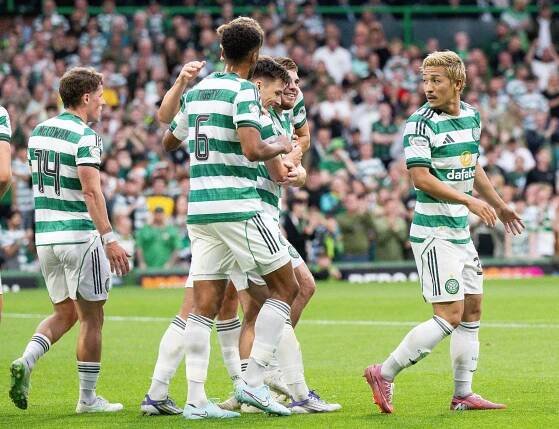 Celtic players celebrating a goal.