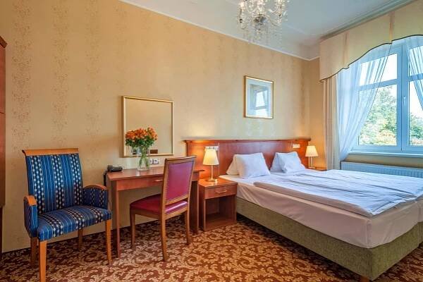 Postel nebo postele na pokoji v ubytování Spa Resort PAWLIK-AQUAFORUM