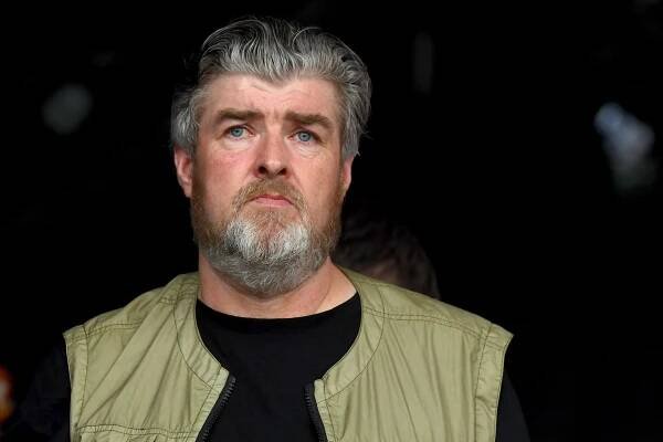 Paul Gallagher watching Liam Gallagher perform at Glastonbury Festival.