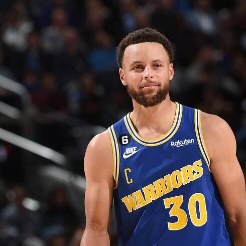 Steph Curry Smiling In Golden State Jersey Wallpaper