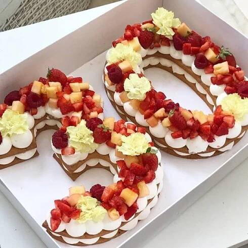 there are four decorated cookies in the shape of numbers