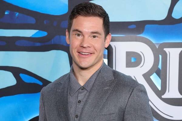 Adam Devine shows off scars from being hit by cement truck as a child: 'Looks like uncooked chicken'