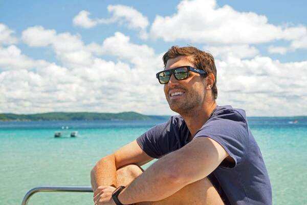 A person wears Maui Jim Kokua Sunglasses