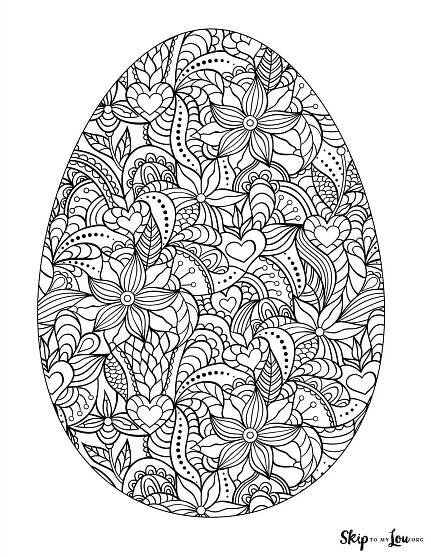 an easter egg decorated with flowers and leaves in black and white on a white background