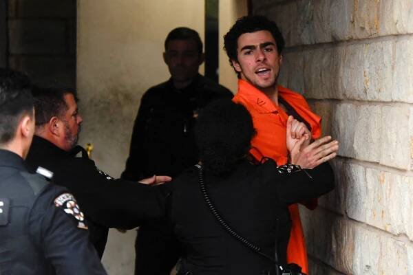 Luigi Mangione arrives for an extradition hearing at Blair County Court House in Hollidaysburg, Pennsylvania