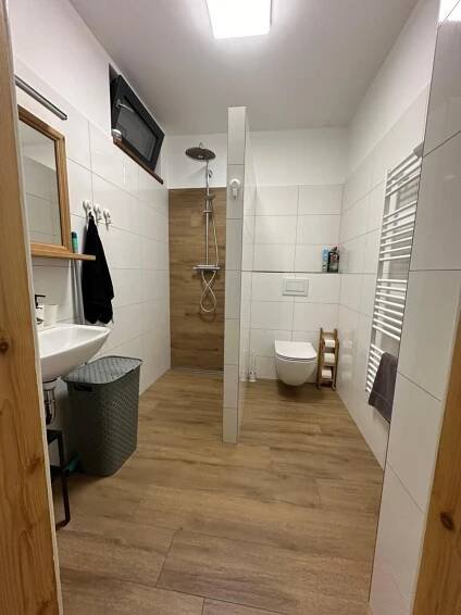 a bathroom with a toilet and a sink at Vila Kosmonautka - Velké Losiny in Velké Losiny