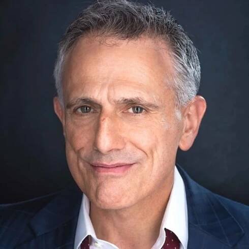 Headshot of David Greenspan, a man with pale skin, short gray hair, and hazel eyes.