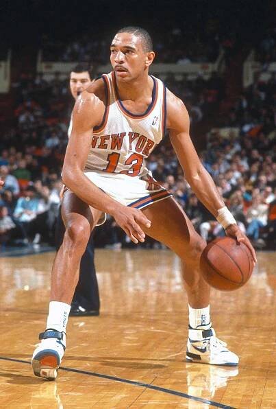 Mark Jackson #13 of the New York Knicks dribbles the ball during an NBA basketball game circa 1990 at Madison Square Garden in the Manhattan borough of New York City.