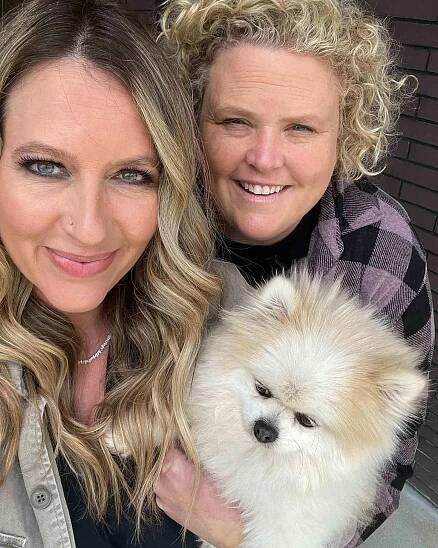 Fortune Feimster and Jaquelyn (Jax) Smith with their dog Biggie. 