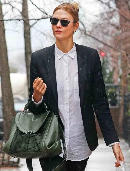 EXCLUSIVE: Karlie Kloss spotted in the rain wearing a black blazer