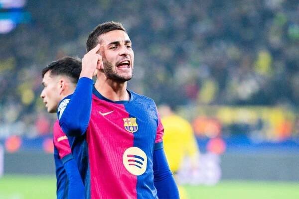 Barcelona forward Ferran Torres celebrates after scoring a goal against Borussia Dortmund.