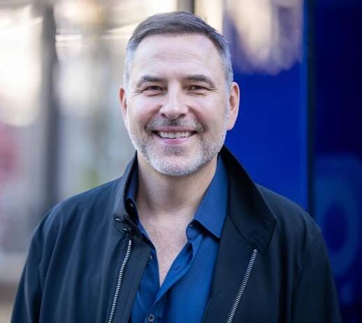 David Walliams smiling for a portrait.