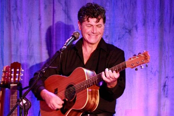 Chris Kelly on the guitar.