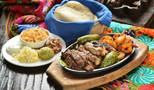 Family Style Feast - No Mas Fajitas made with marinated steak, chicken and shrimp, freshly made 