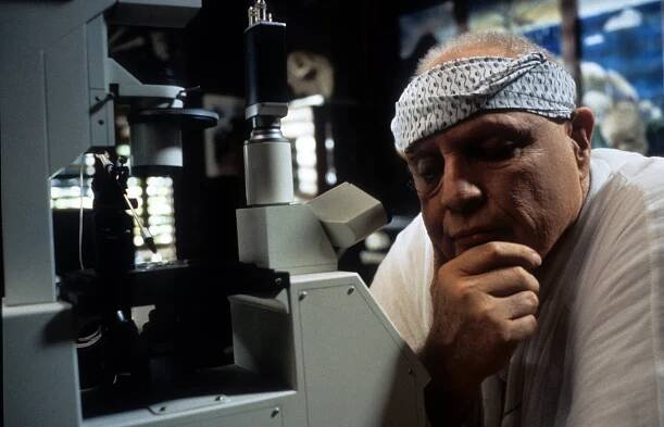 Marlon Brando in 'The Island of Dr. Moreau.' The actor's performance in the film became infamous for all the wrong reasons. While he could have echoed Michael Caine's response about his involvement in 'Jaws: The Revenge' —“I have never seen the film, but by all accounts it was terrible. However I have seen the house that it built, and it is terrific” — the adaptation of H.G. Wells' science fiction novel turned out to be more than just bad; it was a slow-motion disaster. The film featured Brando alongside the unpredictable Val Kilmer, and their notorious clashes created a spectacle as much off-screen as on. Brando was the big star of the movie that also starred the unpredictable Val Kilmer, and the chaos between their egos made for a disastrous result. But what no one anticipated was how unprofessionally Brando would act. He refused to memorize his lines, instead having them fed to him through an earpiece, resulting in a performance that was deeply disconcerting. Perhaps Brando's bizarre performance in 'The Island of Dr. Moreau' was a silent protest for not being allowed to rewrite the script as he’d hoped, a demand he had made clear multiple times. Those who managed to stay sane during the production describe Brando as absent, capricious, and seemingly more focused on sabotaging the film than preserving his dignity as an actor. The director, the experienced John Frankenheimer, did give in to one of Brando's demands: Moreau’s character would be covered in a white cream to supposedly protect him from the sun, a move that allowed Brando to disengage from the film entirely. His stand-in was the one who endured the long hours, while Brando floated in and out of the production. Despite the absurdity of his performance, it wasn't the most laughable in his career. That dubious honor belongs to his portrayal of a Japanese character in 'The Teahouse of the August Moon' — a role that epitomized the 1950s' golden age of political incorrectness. 