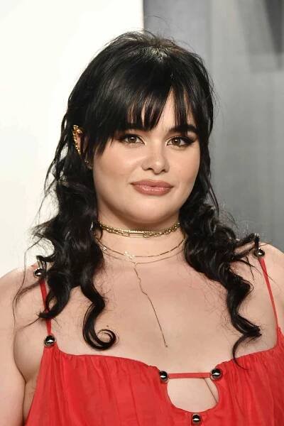 Barbie Ferreira wearing a red dress with her hair in a curly wolf cut