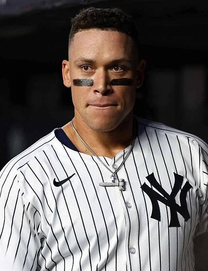 Aaron Judge #99 of the New York Yankees looks on from the dugout during the game against the Arizona Diamondbacks at Yankee Stadium on April 3, 2025 in New York, New York.