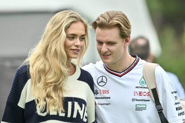 Laila Hasonovic and Mick Schumacher at a racetrack.