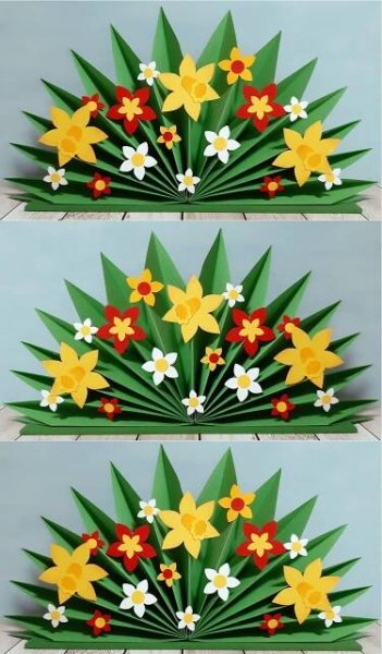 paper flowers are arranged on top of each other in the shape of leaves and flowers