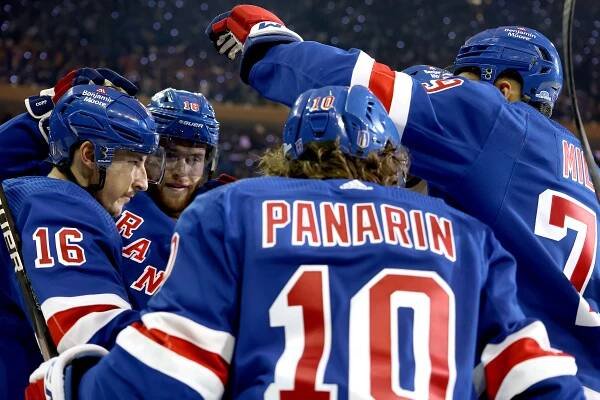 The Rangers celebrate during their Game 1 win over the Lightning.
