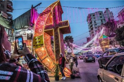 Light installations fill a street at night in the busy city of Cairo to celebrate Ramadan 