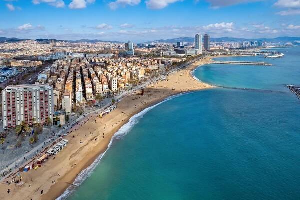 Aerial view of Barcelona's beach and city.