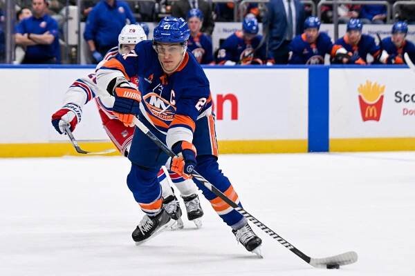 New York Islanders left wing Anders Lee (27) passes the puck against the New York Rangers during the second period at UBS Arena. 