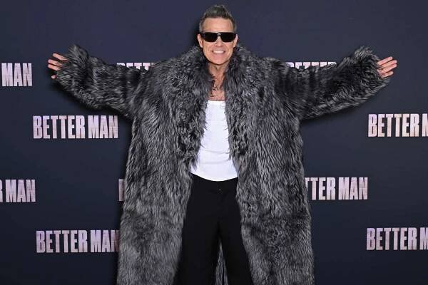 Robbie Williams attends the "Better Man" Paris Premiere at the Le Grand Rex on December 13, 2024 in Paris, 