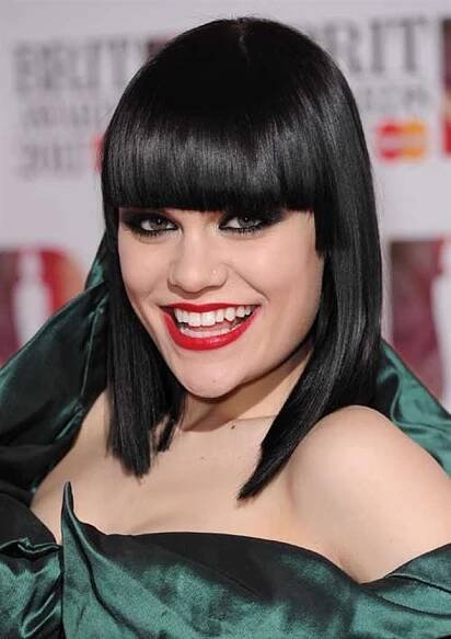Medium Hairstyles with Bangs for 2021  Jessie J is for contours and sharp edges. She is razor sharp with her black bangs cut perfectly straight.