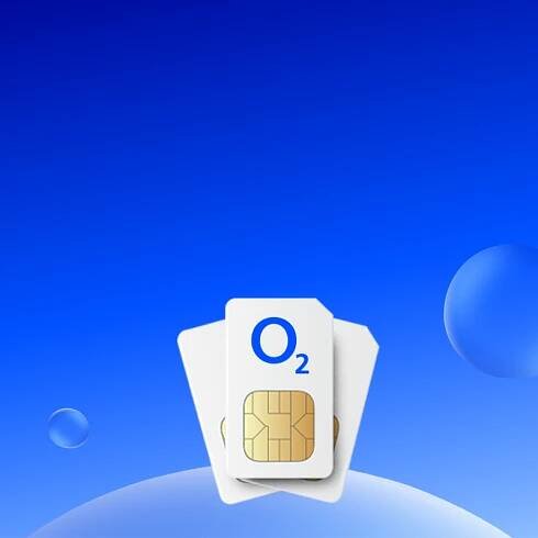 Three SIM cards on top of each other on blue background