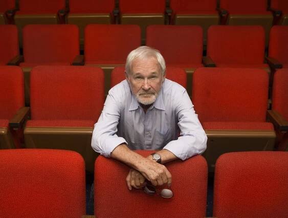 Norman Jewison sitting in theatre seats