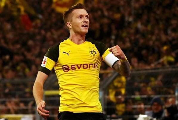 Marco Reus scored twice to keep Dortmund in the game